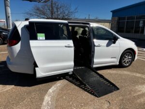 White Chrysler Voyager with Driverge Side Entry Automatic Fold Out conversion