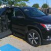 Black Chevrolet Traverse with BraunAbility Side Entry Automatic In Floor conversion
