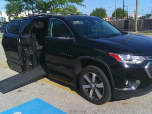 Black Chevrolet Traverse with BraunAbility Side Entry Automatic In Floor conversion