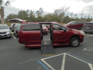 Red Chrysler Pacifica with Driverge Side Entry Automatic Fold Out conversion