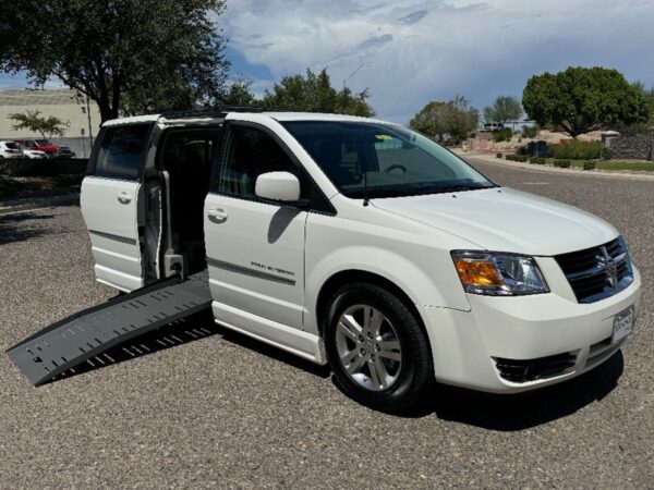 White Dodge Grand Caravan with BraunAbility Side Entry Automatic Fold Out conversion
