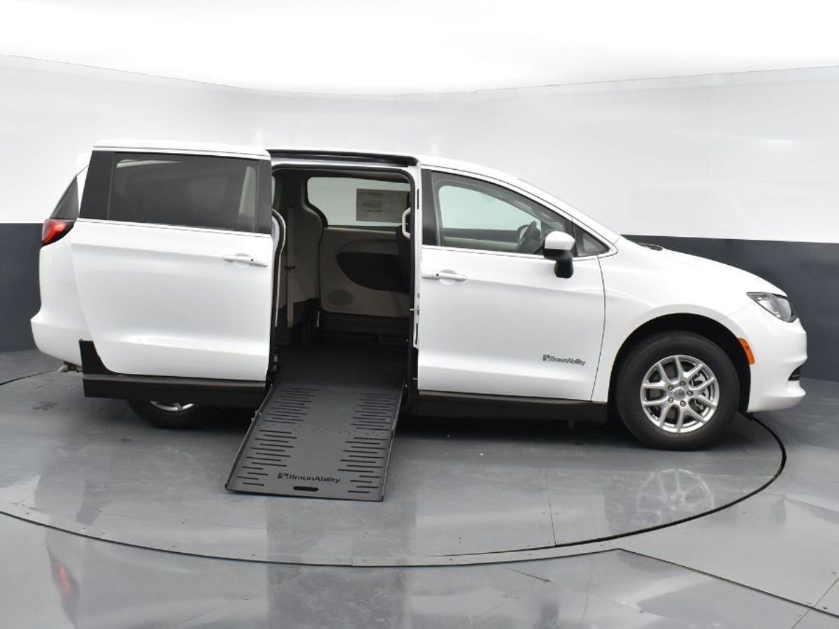 White Chrysler Voyager with BraunAbility Side Entry Manual Fold Out conversion