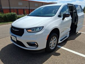 White Chrysler Pacifica with BraunAbility Side Entry Automatic Fold Out conversion