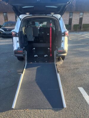 White Toyota Sienna with Driverge Rear Entry Manual Fold Out conversion