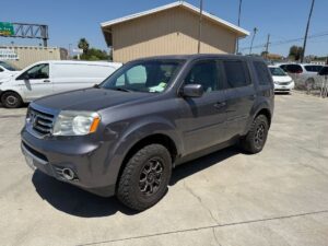 Silver Honda Pilot with Freedom Motors Rear Entry Manual Fold Out conversion