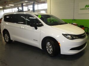 White Chrysler Voyager with Driverge Rear Entry Manual Fold Out conversion