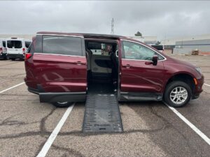 Red Chrysler Voyager with BraunAbility Side Entry Manual Fold Out conversion