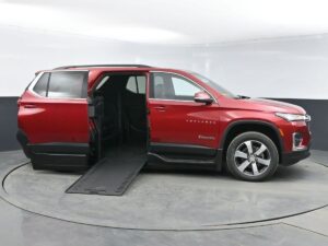 Red Chevrolet Traverse with BraunAbility Side Entry Automatic In Floor conversion