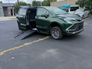 Green Toyota Sienna with BraunAbility Side Entry Automatic Fold Out conversion