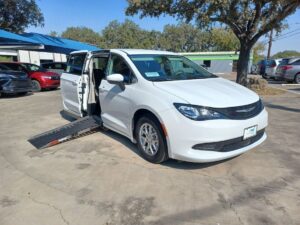 White Chrysler Voyager with Adaptive Vans Side Entry Automatic Fold Out conversion