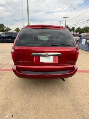 Red Chrysler Town and Country with BraunAbility Side Entry Manual Fold Out conversion