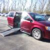 Red Dodge Grand Caravan with Driverge Side Entry Automatic Fold Out conversion
