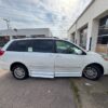 White Toyota Sienna with BraunAbility Side Entry Automatic Fold Out conversion