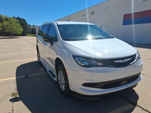 White Chrysler Voyager with BraunAbility Side Entry Automatic In Floor conversion