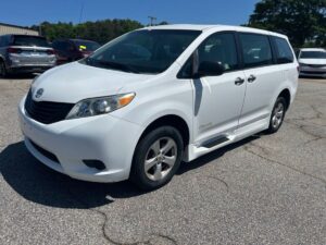White Toyota Sienna with BraunAbility Side Entry Manual Fold Out conversion