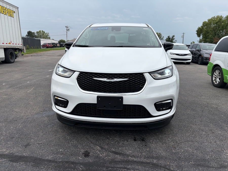 White Chrysler Pacifica with BraunAbility Side Entry Automatic Fold Out conversion