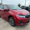Red Honda Odyssey with BraunAbility Side Entry Automatic In Floor conversion