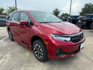 Red Honda Odyssey with BraunAbility Side Entry Automatic In Floor conversion