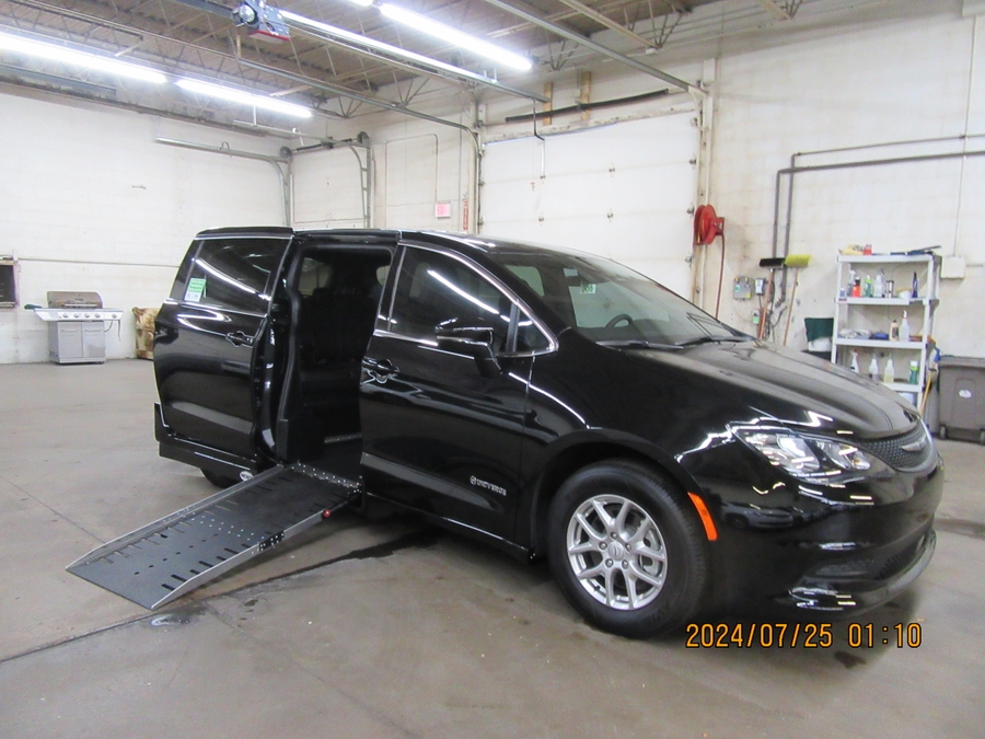 Black Chrysler Voyager with Driverge Side Entry Automatic Fold Out conversion