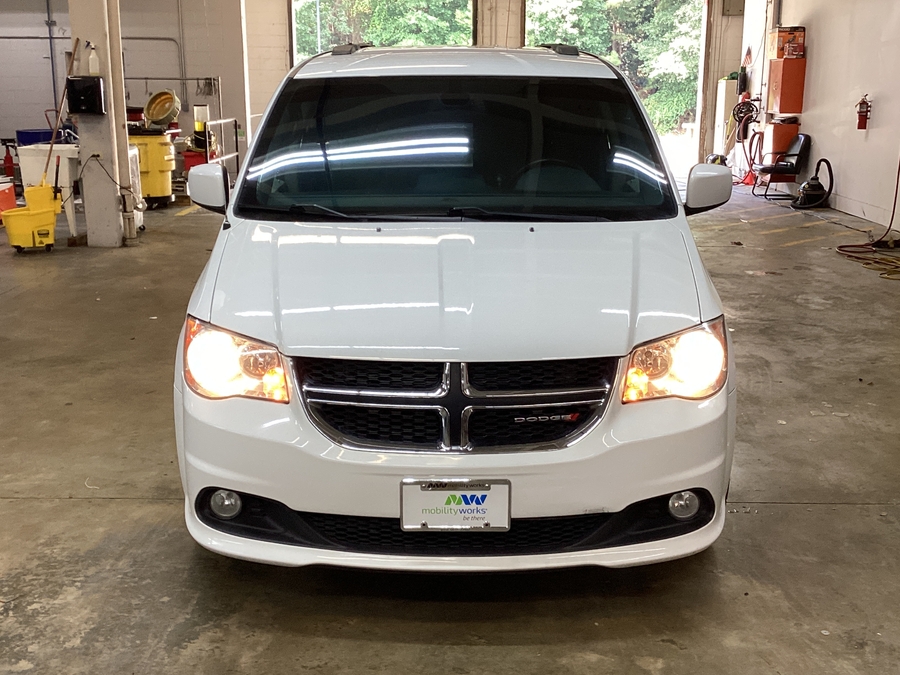 White Dodge Grand Caravan with Adaptive Vans Side Entry Automatic Fold Out conversion