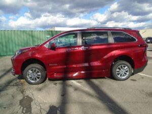 Red Toyota Sienna with BraunAbility Side Entry Automatic Fold Out conversion