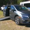 Green Honda Odyssey with BraunAbility Side Entry Automatic In Floor conversion