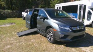 Green Honda Odyssey with BraunAbility Side Entry Automatic In Floor conversion