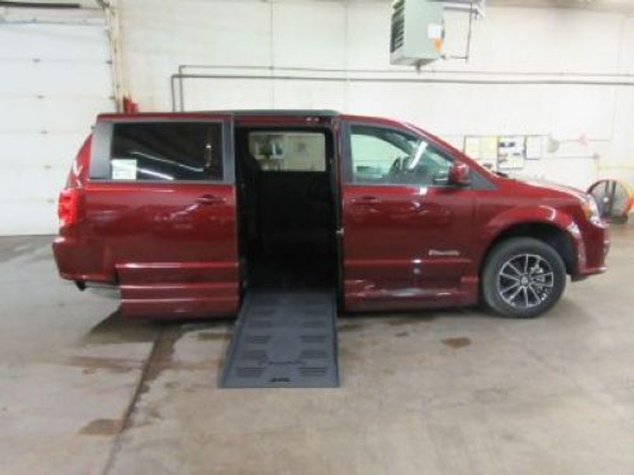 Red Dodge Grand Caravan with BraunAbility Side Entry Automatic Fold Out conversion