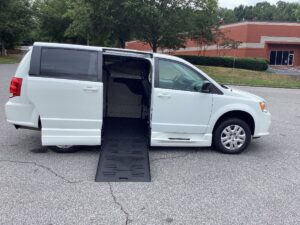 White Dodge Grand Caravan with BraunAbility Side Entry Manual Fold Out conversion