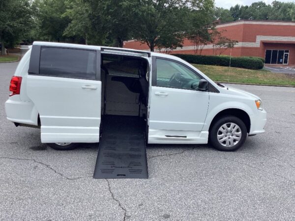 White Dodge Grand Caravan with BraunAbility Side Entry Manual Fold Out conversion
