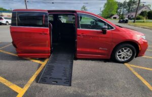 Red Chrysler Pacifica with BraunAbility Side Entry Automatic Fold Out conversion