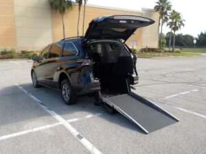 Black Toyota Sienna with Driverge Rear Entry Manual Fold Out conversion