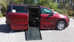 Red Chrysler Voyager with BraunAbility Side Entry Automatic Fold Out conversion