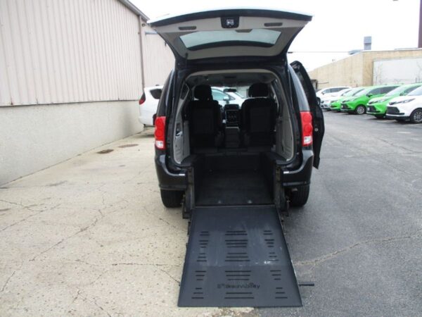 Black Dodge Grand Caravan with BraunAbility Rear Entry Manual Fold Out conversion