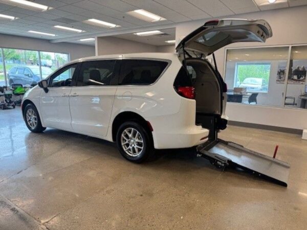 White Chrysler Voyager with Driverge Rear Entry Manual Fold Out conversion