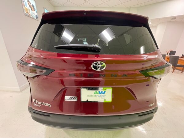 Red Toyota Sienna with BraunAbility Side Entry Automatic Fold Out conversion