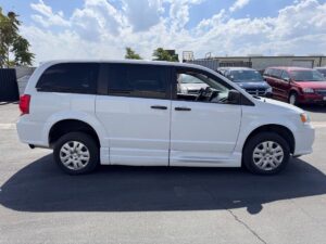White Dodge Grand Caravan with BraunAbility Side Entry Manual Fold Out conversion