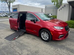 Red Chrysler Pacifica with Driverge Side Entry Automatic Fold Out conversion