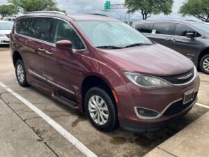 Red Chrysler Pacifica with BraunAbility Side Entry Automatic In Floor conversion