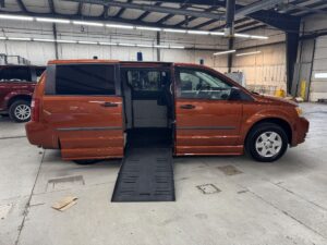 Orange Dodge Grand Caravan with BraunAbility Side Entry Automatic Fold Out conversion