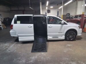 White Dodge Grand Caravan with BraunAbility Side Entry Automatic Fold Out conversion