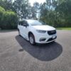 White Chrysler Pacifica with BraunAbility Side Entry Automatic Fold Out conversion