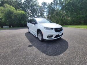 White Chrysler Pacifica with BraunAbility Side Entry Automatic Fold Out conversion