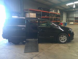 Black Chrysler Pacifica with Driverge Side Entry Automatic Fold Out conversion