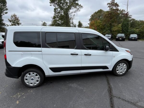White Ford Transit Connect with Driverge Rear Entry Manual Fold Out conversion