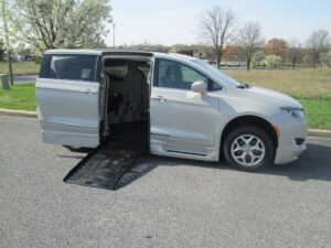 White Chrysler Pacifica with BraunAbility Side Entry Automatic Fold Out conversion