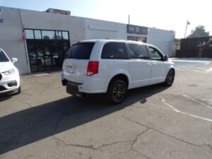 White Dodge Grand Caravan with Driverge Rear Entry Manual Fold Out conversion