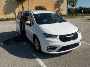 White Chrysler Pacifica with Driverge Side Entry Automatic Fold Out conversion