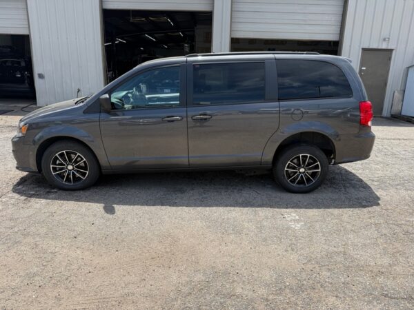 Grey Dodge Grand Caravan with Adaptive Vans Side Entry Automatic Fold Out conversion