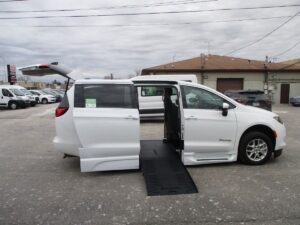 White Chrysler Voyager with BraunAbility Side Entry Automatic Fold Out conversion